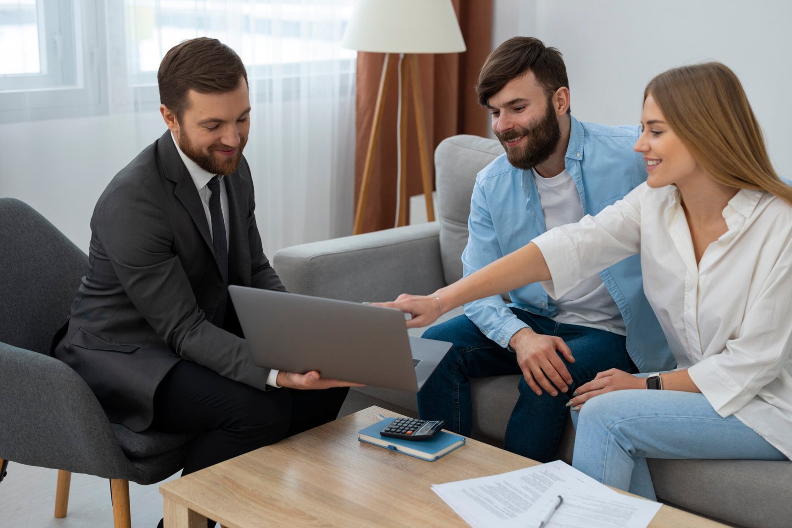 male-real-estate-agent-doing-business-showing-house-potential-buying-couple